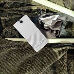 Black with gold stitching and lacing form fitting dress